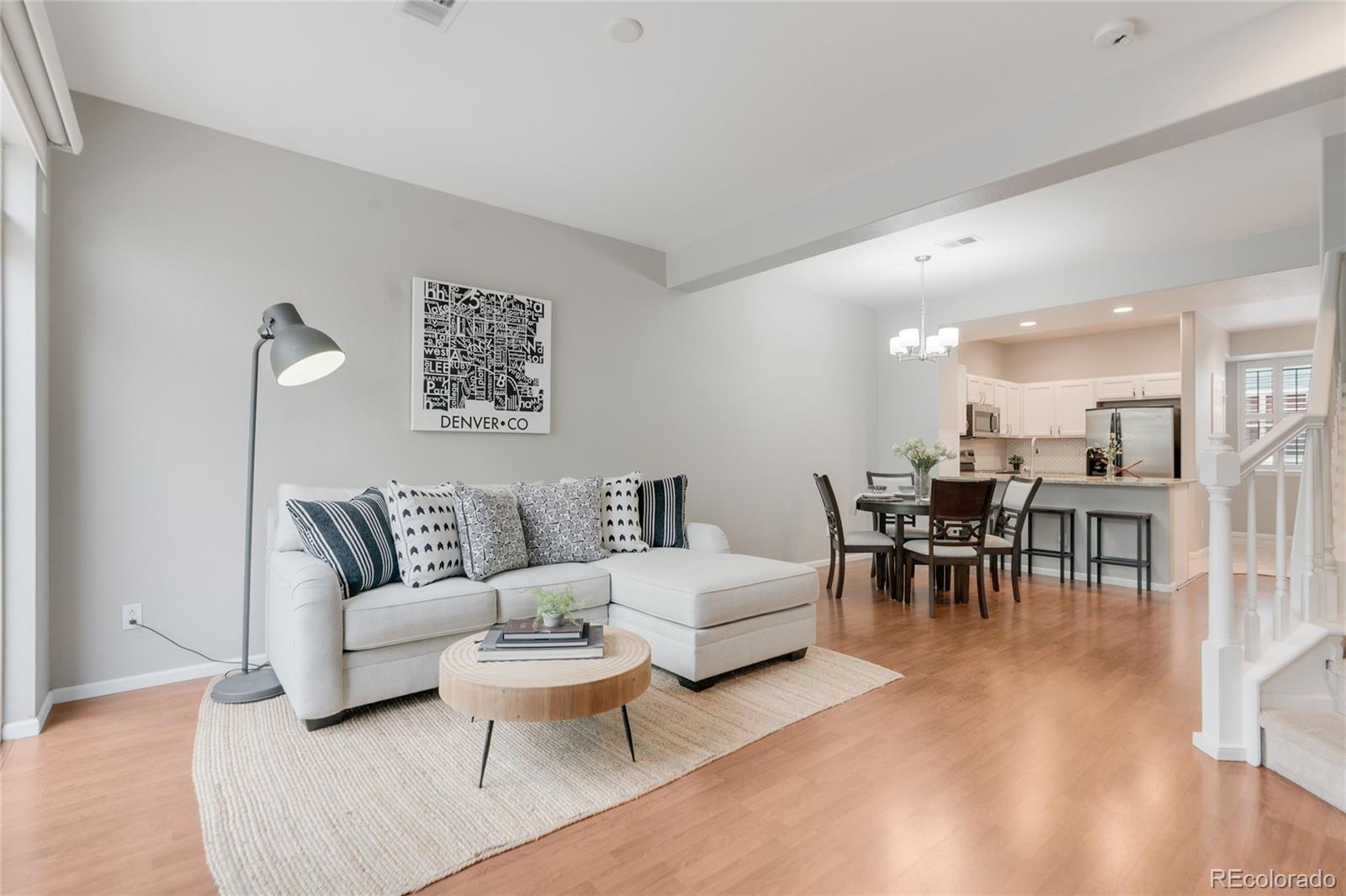 5392 Allison Street Arvada, CO 80002 - Photo 2 of 47 a living room with furniture and a table