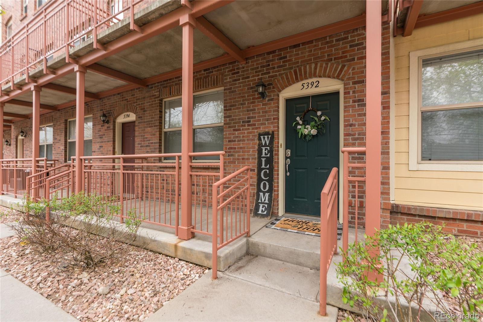 5392 Allison Street Arvada, CO 80002 - Photo 28 of 47 front view of a house with a porch