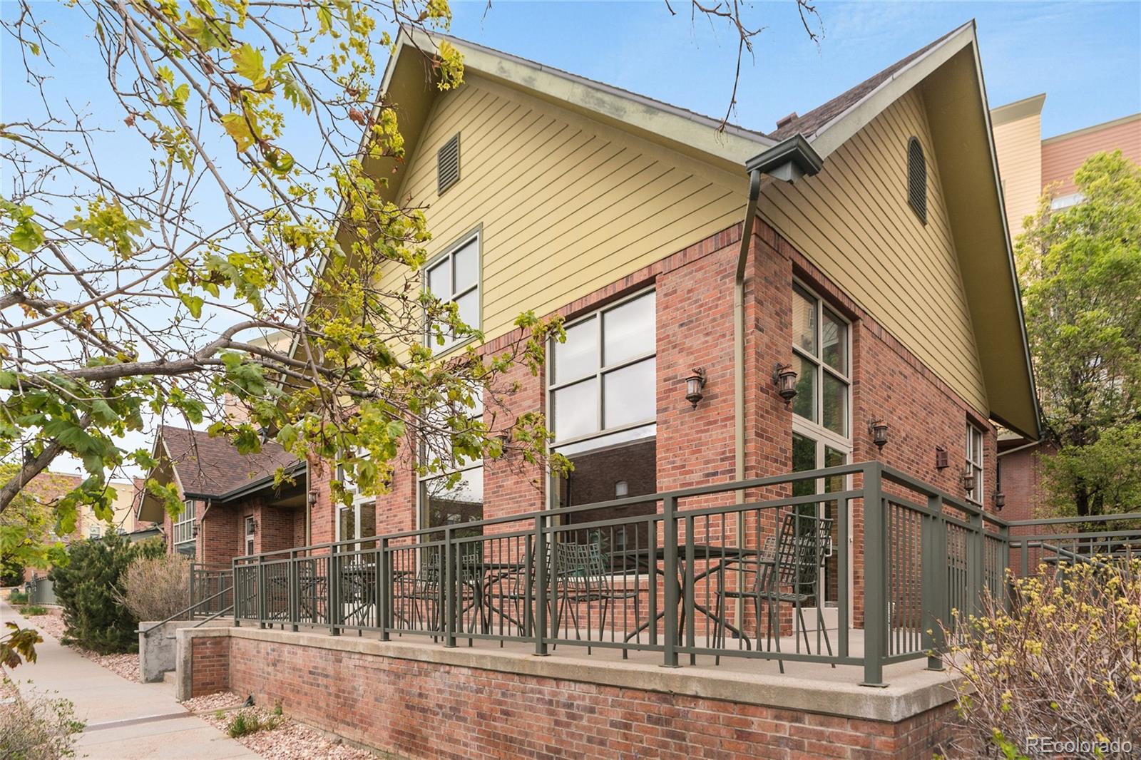 5392 Allison Street Arvada, CO 80002 - Photo 32 of 47 a front view of a house with a tree