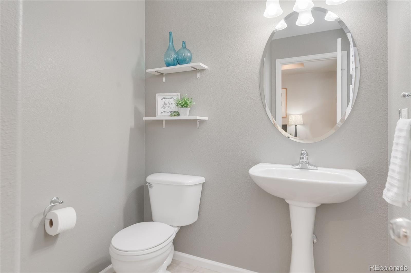 5392 Allison Street Arvada, CO 80002 - Photo 8 of 47 a bathroom with a toilet sink and mirror