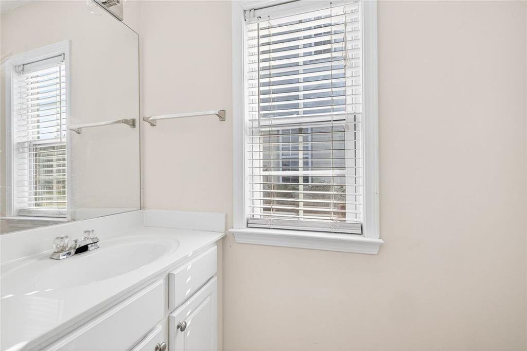 4010 Ridgefair Drive Cumming, GA 30040 - Photo 16 of 28 a bathroom with a sink and a bathtub