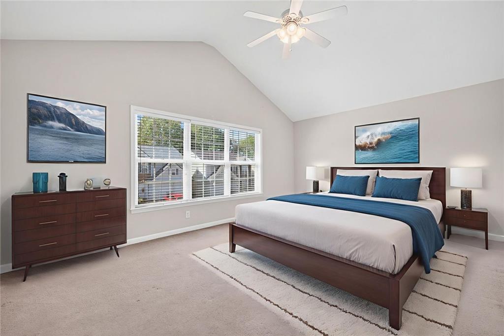 4010 Ridgefair Drive Cumming, GA 30040 - Photo 18 of 28 a spacious bedroom with a large bed and a window
