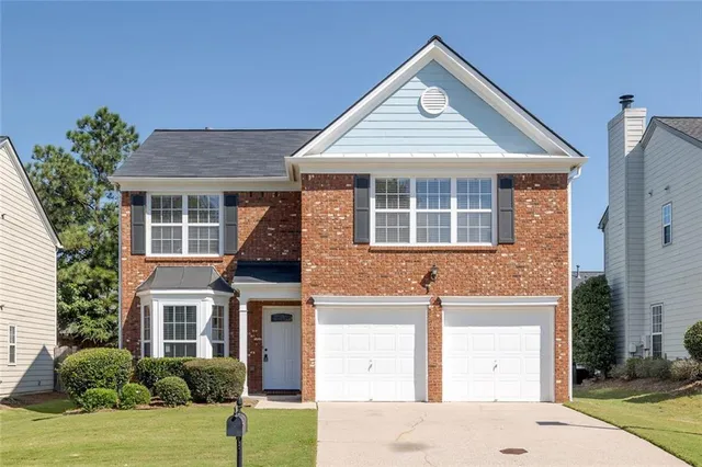 front view of a house with a yard