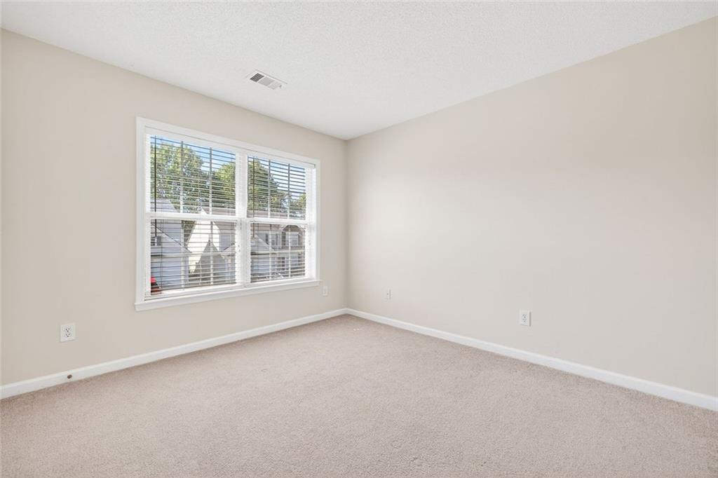4010 Ridgefair Drive Cumming, GA 30040 - Photo 23 of 28 an empty room with a window