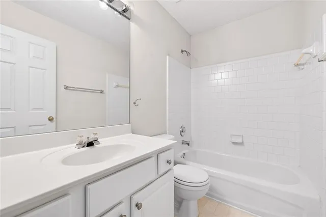 a bathroom with a sink a toilet and a bathtub