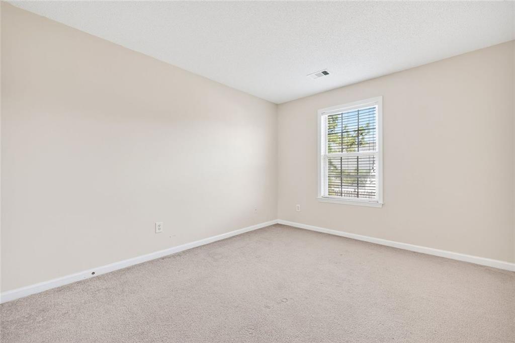 4010 Ridgefair Drive Cumming, GA 30040 - Photo 25 of 28 an empty room with a window