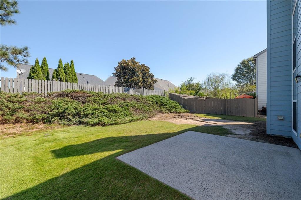 4010 Ridgefair Drive Cumming, GA 30040 - Photo 26 of 28 a view of a yard with yellow house