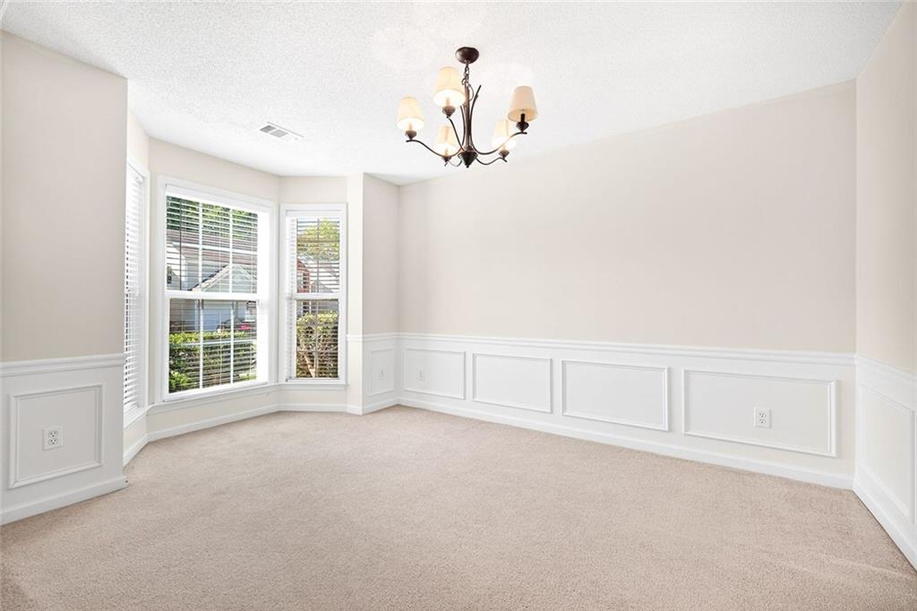 4010 Ridgefair Drive Cumming, GA 30040 - Photo 5 of 28 an empty room with windows