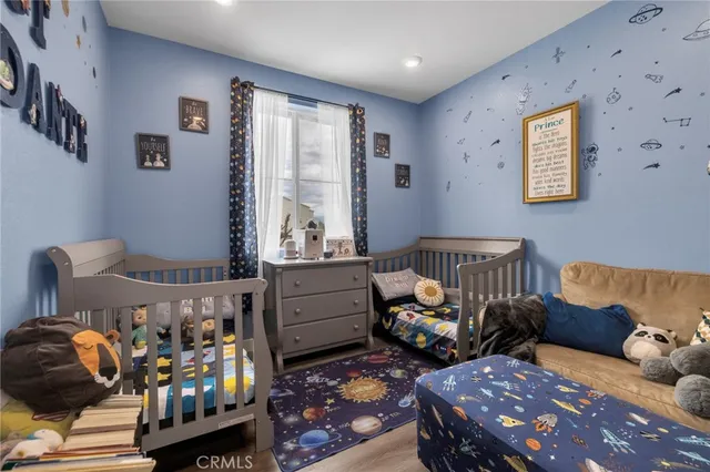 a bedroom with furniture and a window