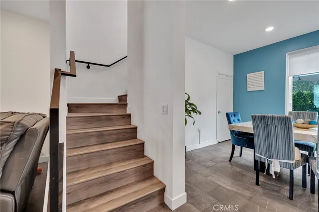 a backyard of a house with table and chairs