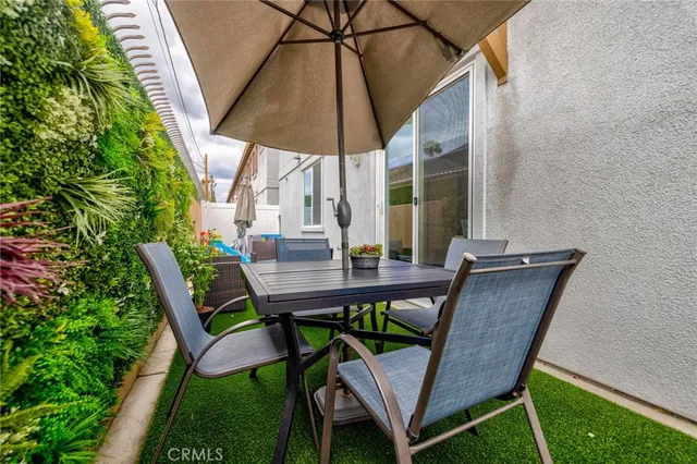 a view of an outdoor sitting area with furniture