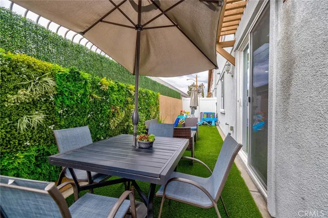a view of an house with backyard porch and furniture
