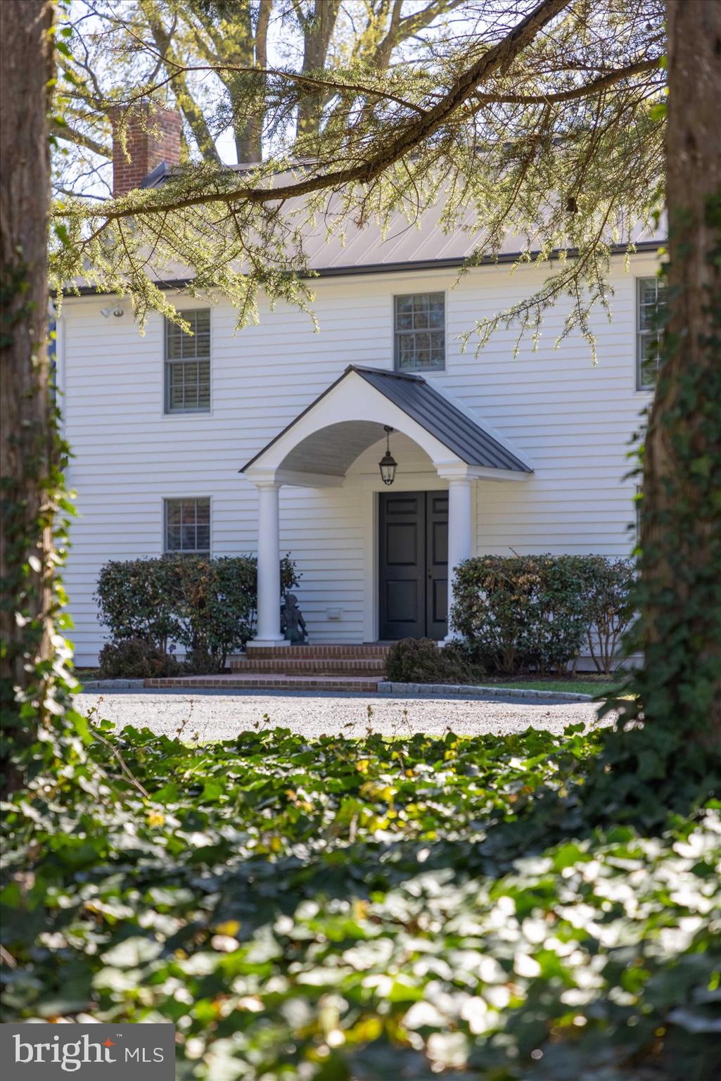 29031 Howell Point Road Trappe, MD 21673 - Photo 22 of 129 a front view of a house with a yard