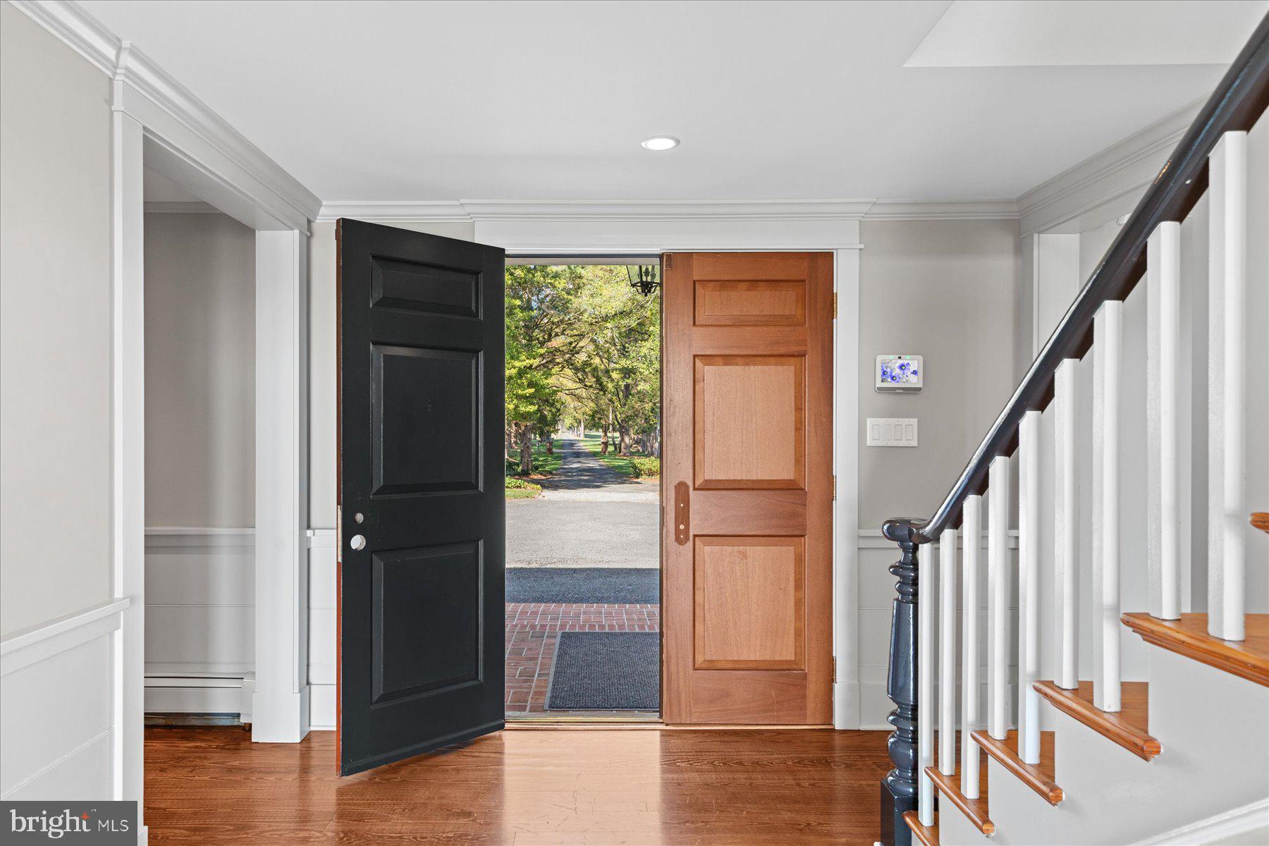 29031 Howell Point Road Trappe, MD 21673 - Photo 26 of 129 a view of entryway with wooden floor and door