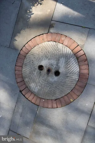 a view of a house with backyard and trees
