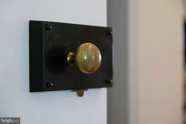 a view of a big house with a big yard and large trees