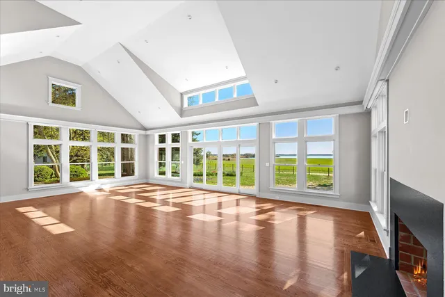 an aerial view of residential houses with outdoor space and swimming pool