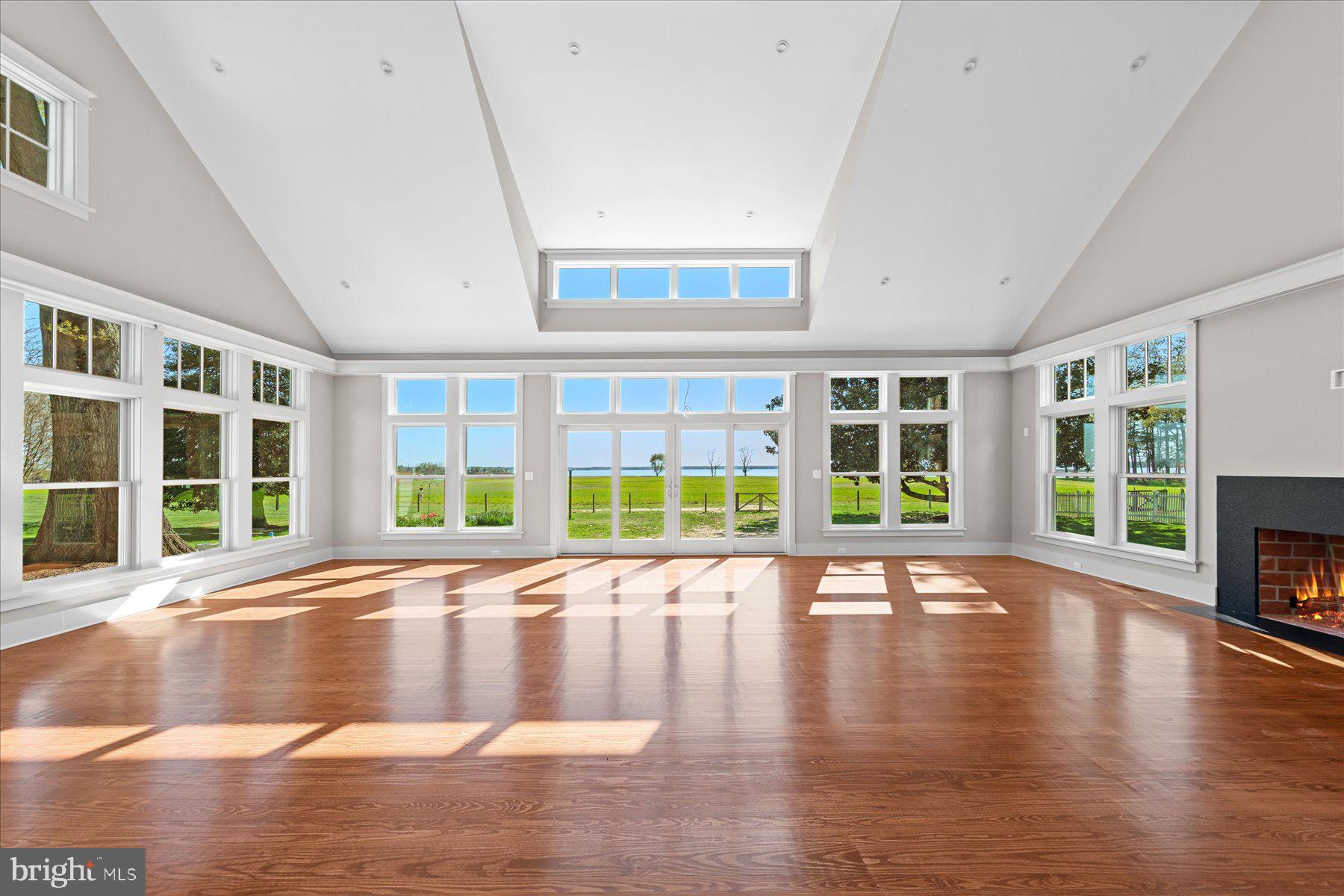 29031 Howell Point Road Trappe, MD 21673 - Photo 41 of 129 a view of an empty room with wooden floor and a window