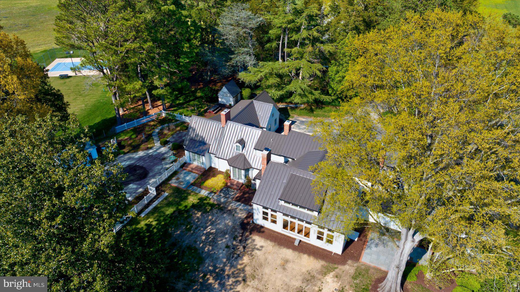 29031 Howell Point Road Trappe, MD 21673 - Photo 85 of 129 an aerial view of a house with a yard and trees
