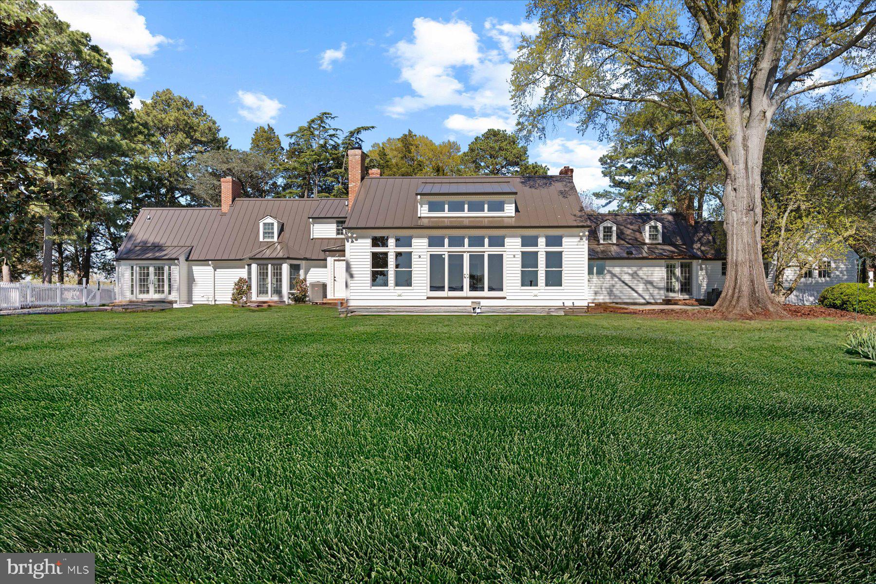 29031 Howell Point Road Trappe, MD 21673 - Photo 86 of 129 a front view of a house with a garden