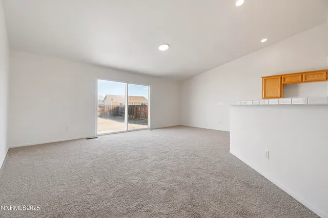 a kitchen with a refrigerator sink and a stove