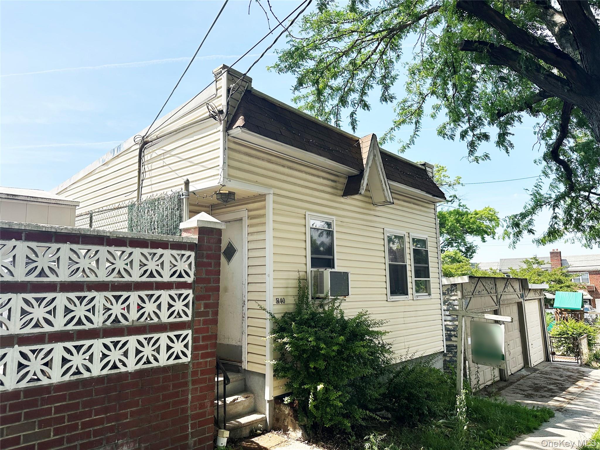 65-38 51st Road Queens, NY 11377 - Photo 5 of 6 Front of the 1-family building.