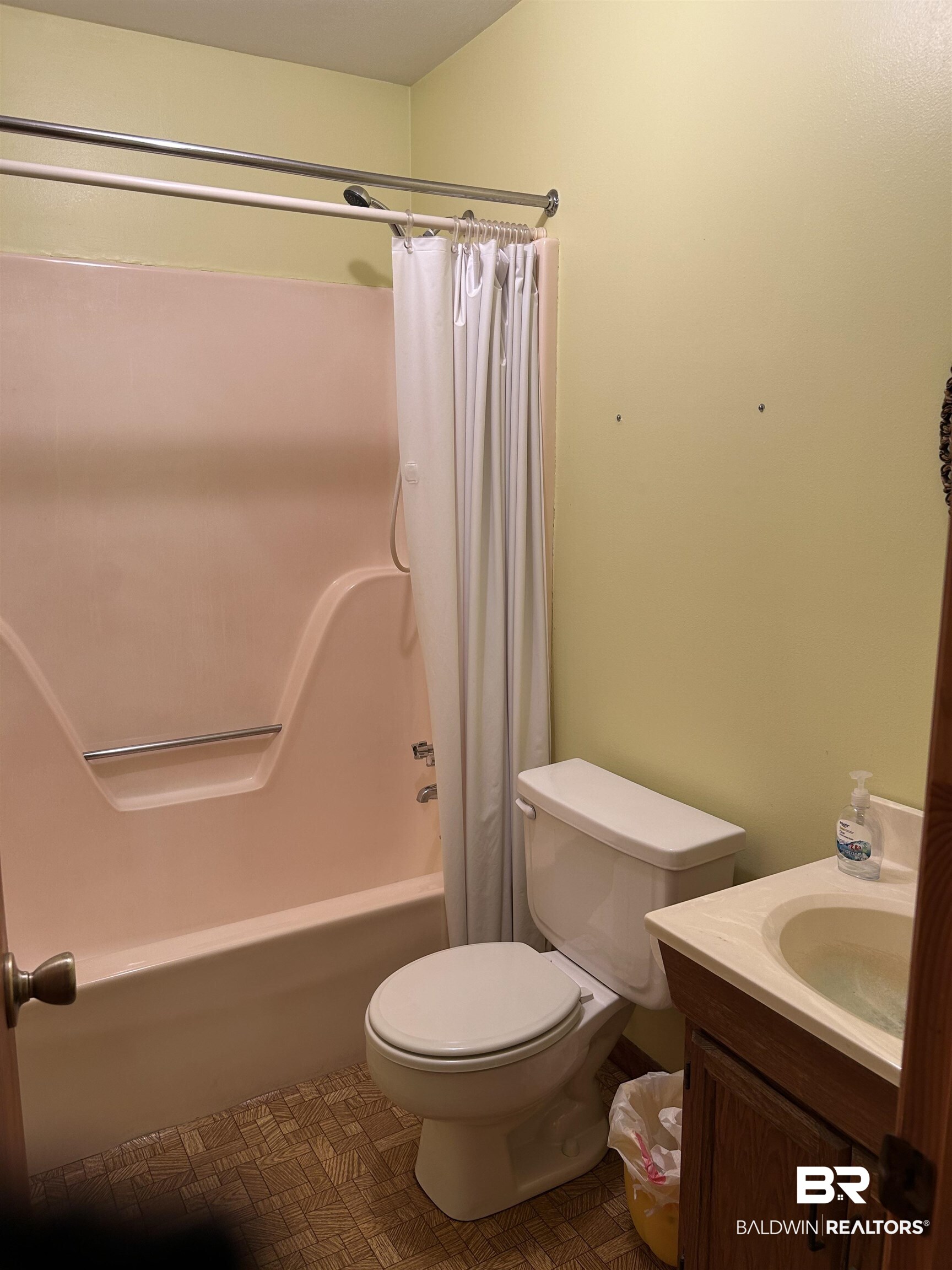 1350 A Schillinger Road South Mobile, AL 36695 - Photo 6 of 18 Full bathroom with shower / bathtub combination with curtain and vanity