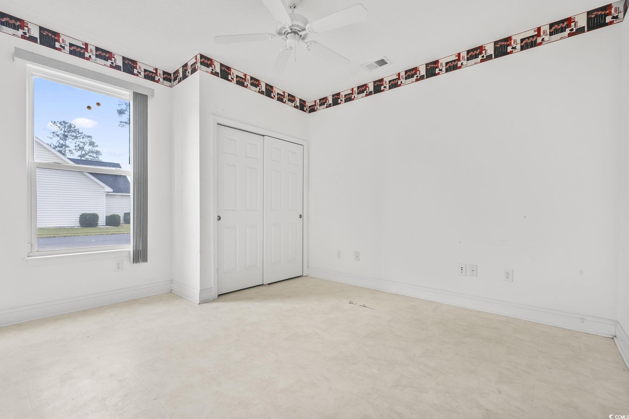 743 Helms Way Conway, SC 29526 - Photo 29 of 37 Unfurnished bedroom featuring a closet and ceiling fan