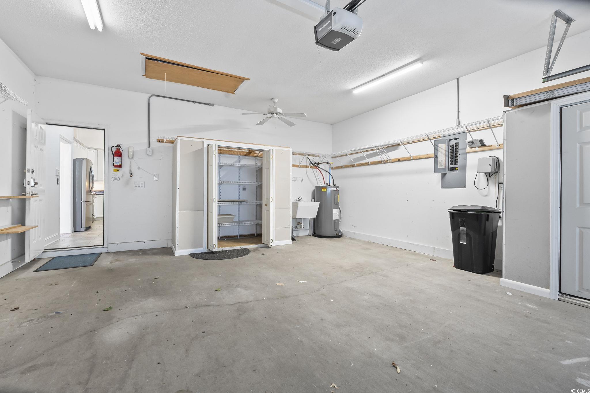 743 Helms Way Conway, SC 29526 - Photo 35 of 37 Garage with custom built ins and laundry sink