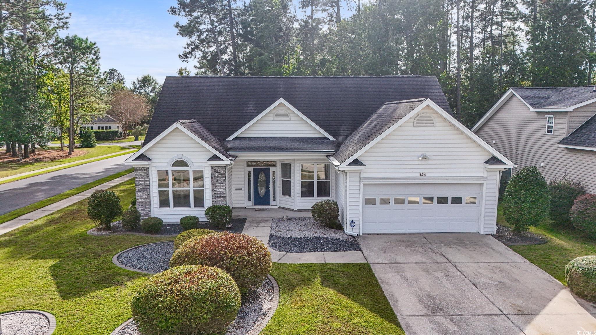 743 Helms Way Conway, SC 29526 - Photo 6 of 37 Traditional-style house with concrete driveway, a front yard, a shingled roof, and an attached garage