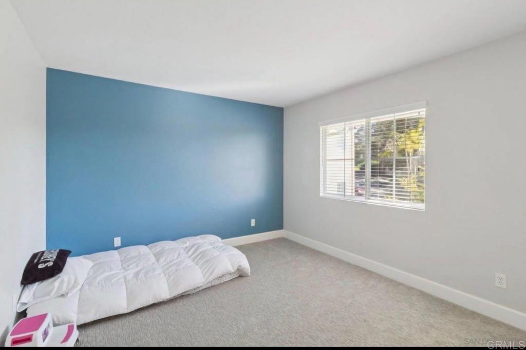 1234 Old Janal Ranch Road Chula Vista, CA 91915 - Photo 19 of 34 a bedroom with a bed and a window
