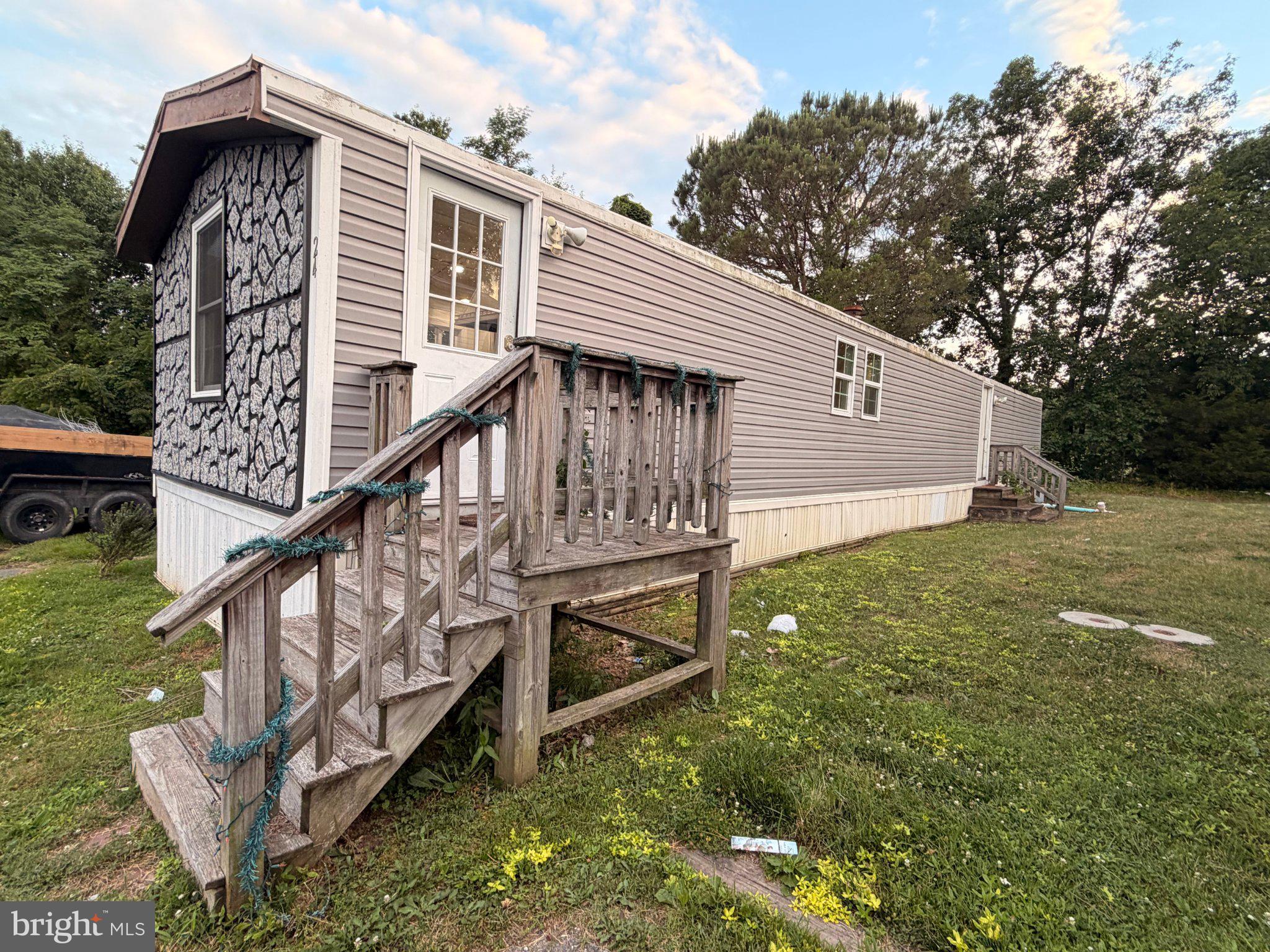 24 Carpenter Street, Unit 24 Dover, DE 19901 - Photo 1 of 27 Charming mobile home with rustic appeal.