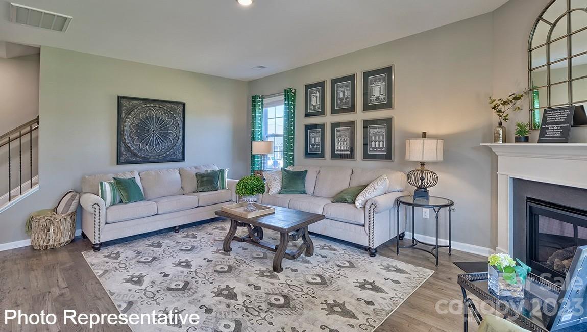 85 Wheatfield Road Fletcher, NC 28732 - Photo 13 of 29 a living room with furniture a fireplace and a table