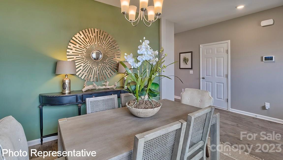 85 Wheatfield Road Fletcher, NC 28732 - Photo 5 of 29 a dining room with furniture and a potted plant