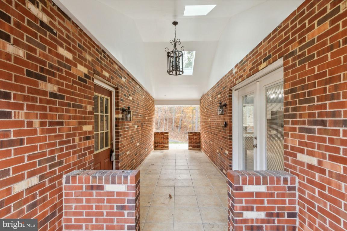 240 Sandy Ridge Road Fredericksburg, VA 22405 - Photo 3 of 43 Extra spacious breezeway (garage on left)