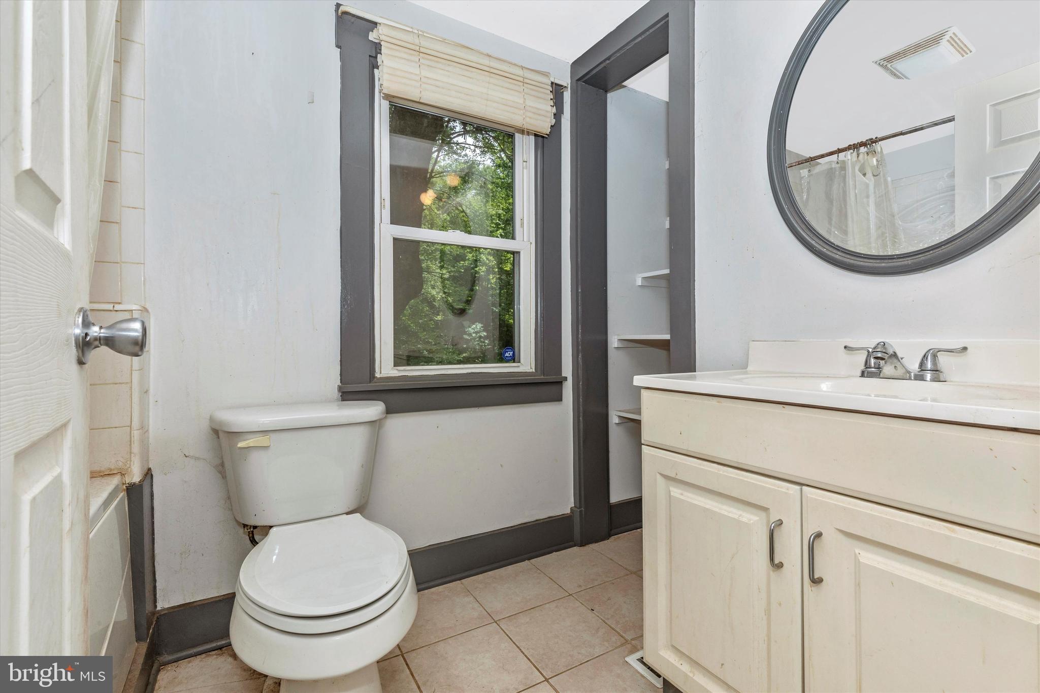 6300 Old Bohn Road Mount Airy, MD 21771 - Photo 32 of 45 a bathroom with a toilet sink and mirror