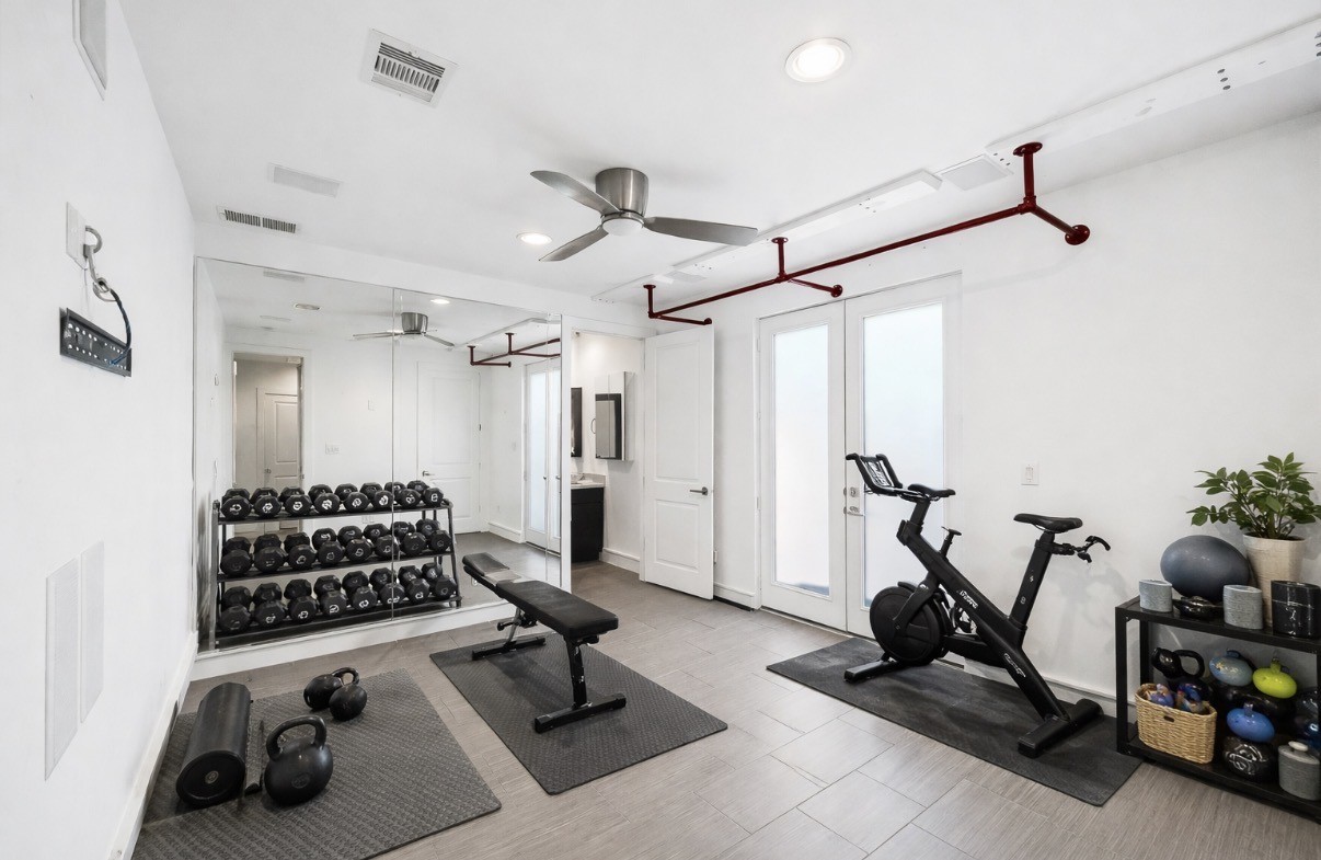 5228 Maxie Street, Unit A Houston, TX 77007 - Photo 5 of 28 Virtually staged first floor secondary bedroom. It can be used as a guest suite, home gym, or office. Wonderful flex space with private access to the back and side yard.