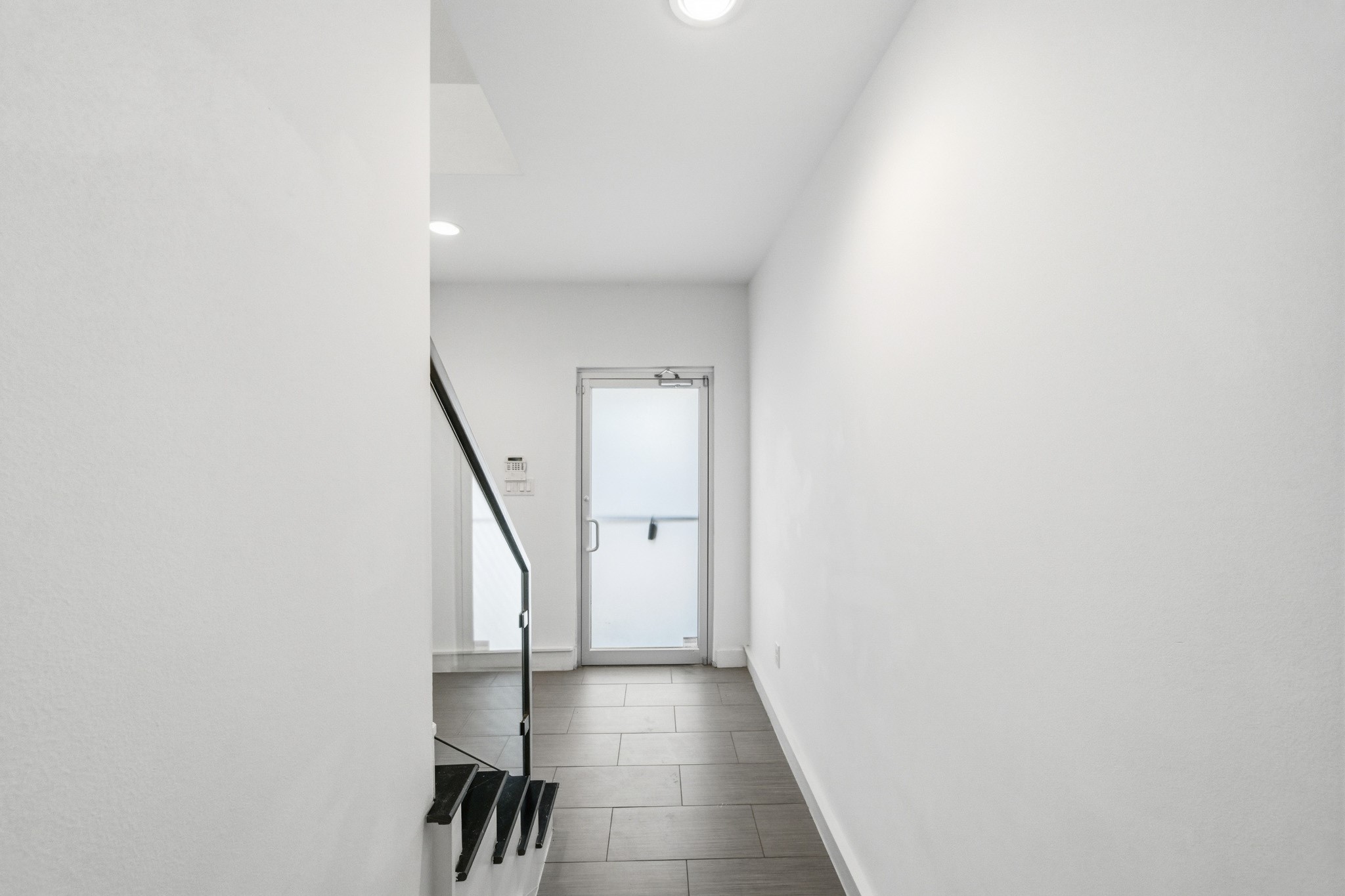 5228 Maxie Street, Unit A Houston, TX 77007 - Photo 7 of 28 Entry hallway with access to the first floor bedroom.