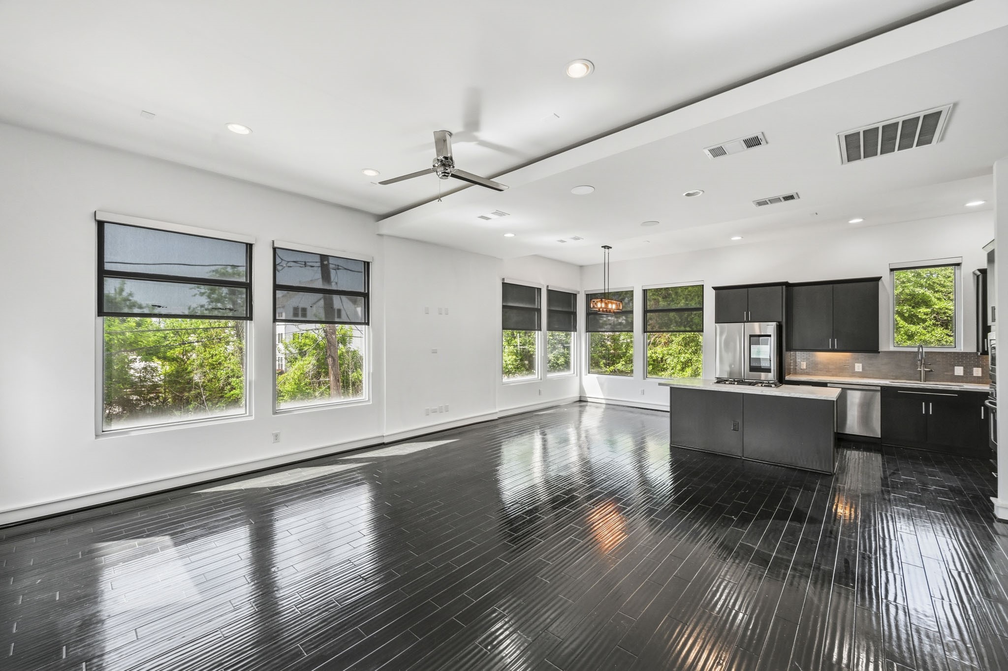 5228 Maxie Street, Unit A Houston, TX 77007 - Photo 10 of 28 Open-concept layout connecting living, dining, and kitchen spaces.
