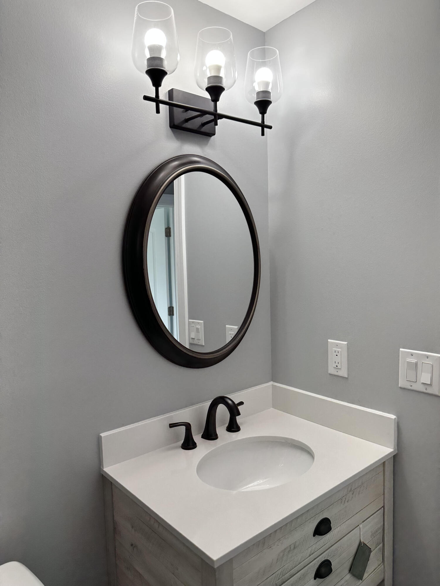 2814 Southeast Indian Street Stuart, FL 34997 - Photo 15 of 23 a bathroom with a sink and a mirror