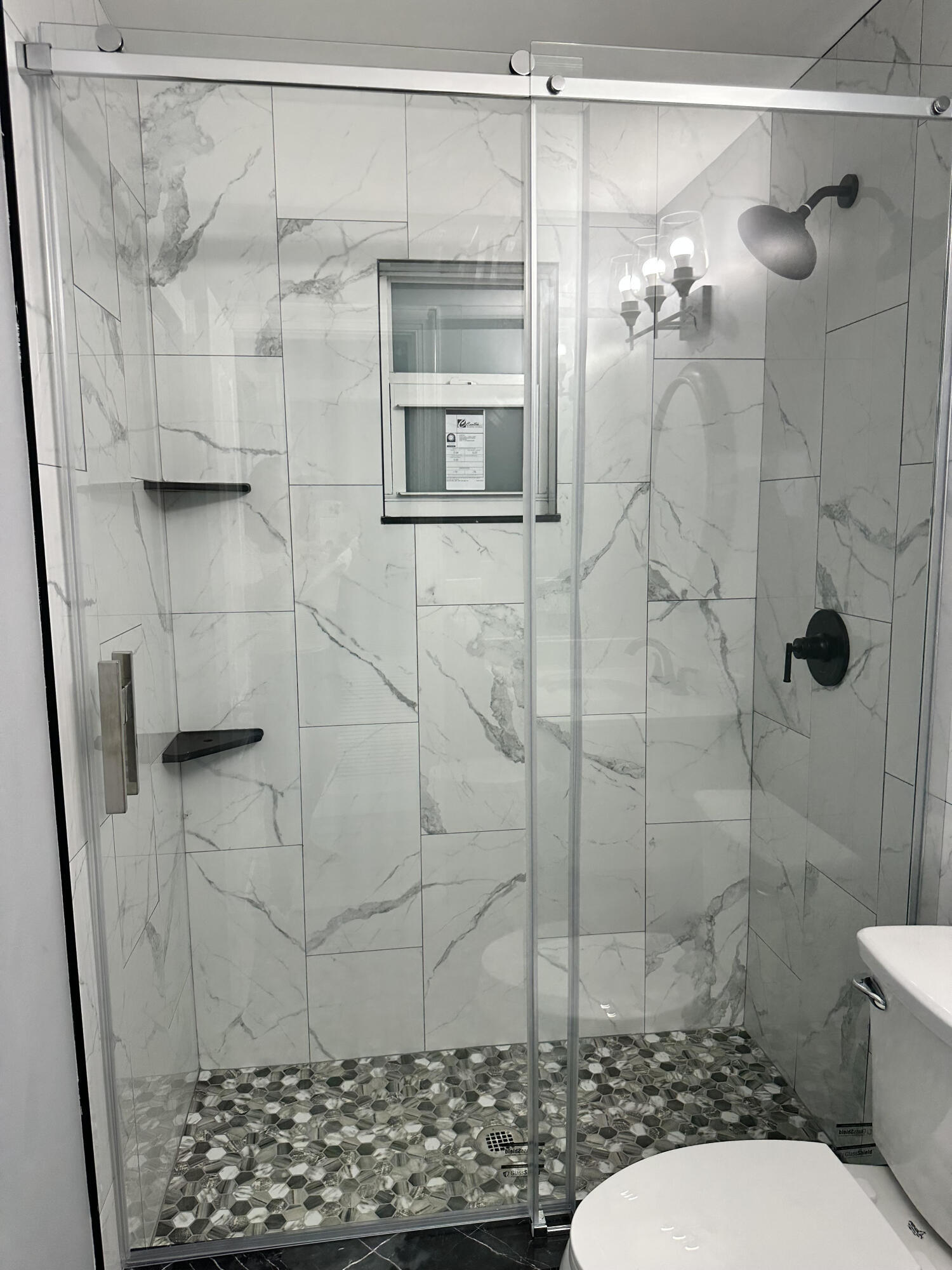 2814 Southeast Indian Street Stuart, FL 34997 - Photo 16 of 23 a bathroom with a shower and a toilet