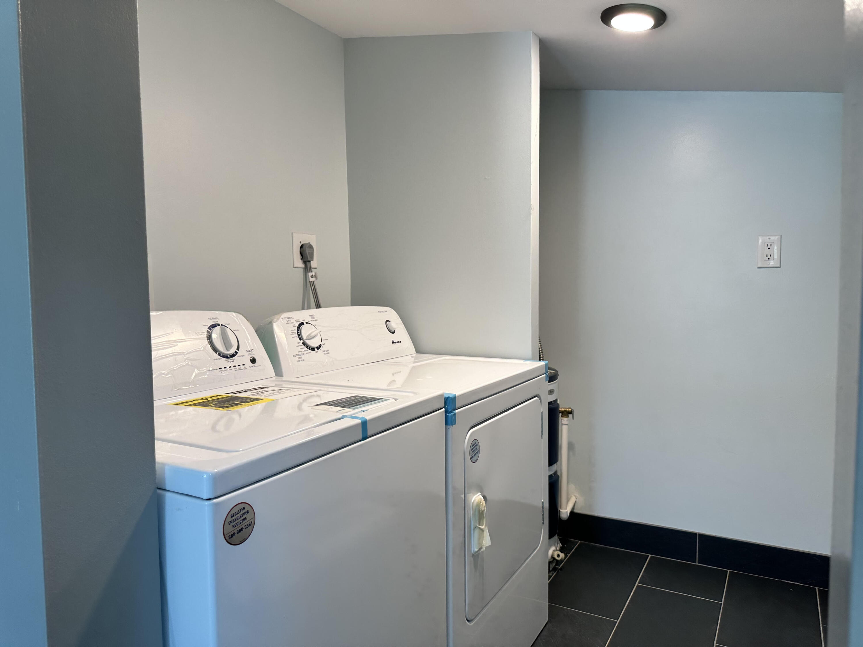 2814 Southeast Indian Street Stuart, FL 34997 - Photo 18 of 23 a utility room with dryer and washer