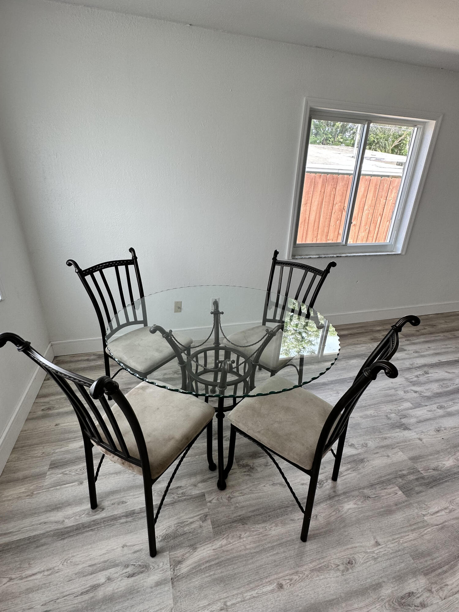 2814 Southeast Indian Street Stuart, FL 34997 - Photo 7 of 23 a bedroom with furniture window and wooden floor