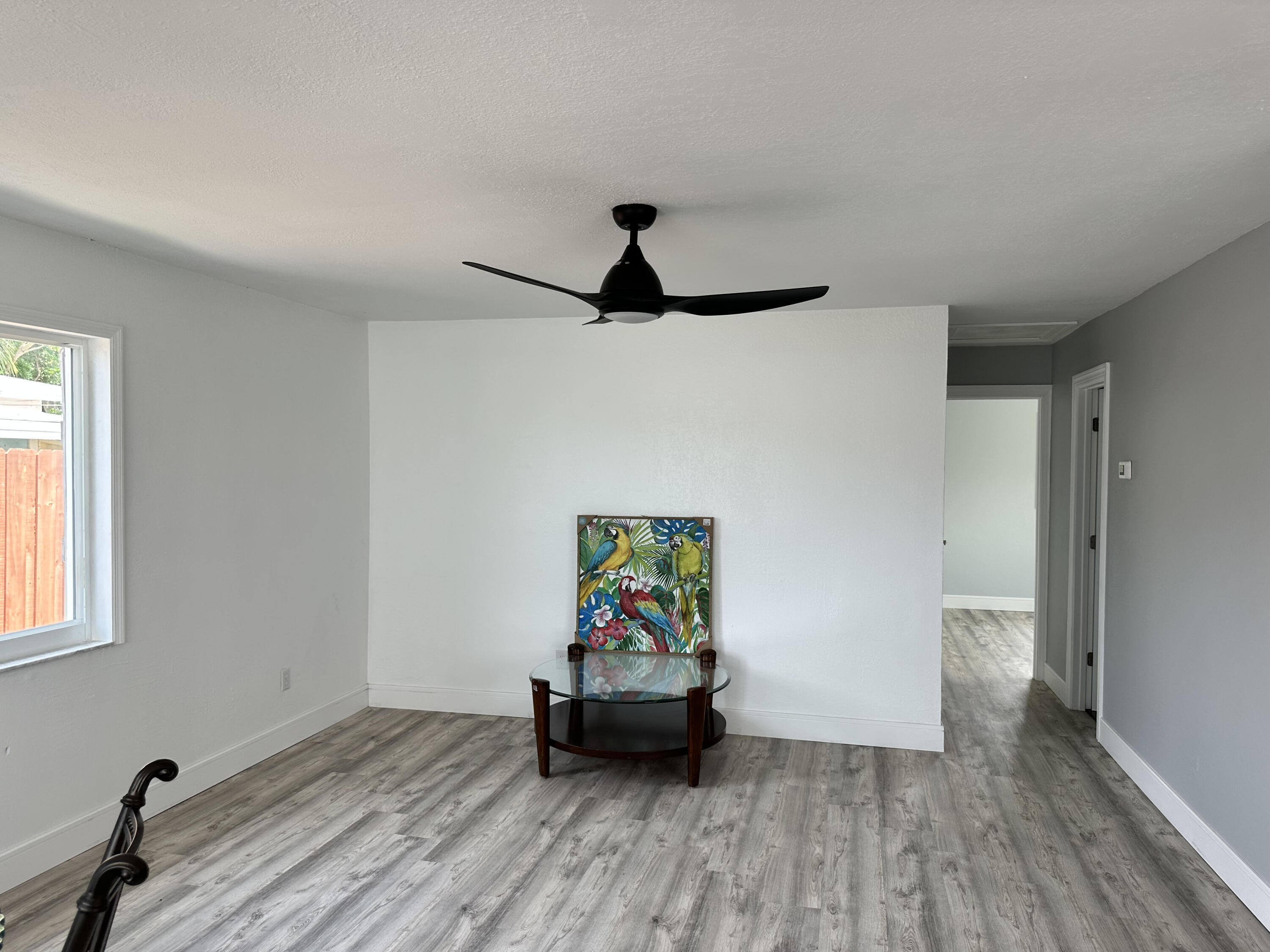 2814 Southeast Indian Street Stuart, FL 34997 - Photo 8 of 23 a living room with furniture and a window