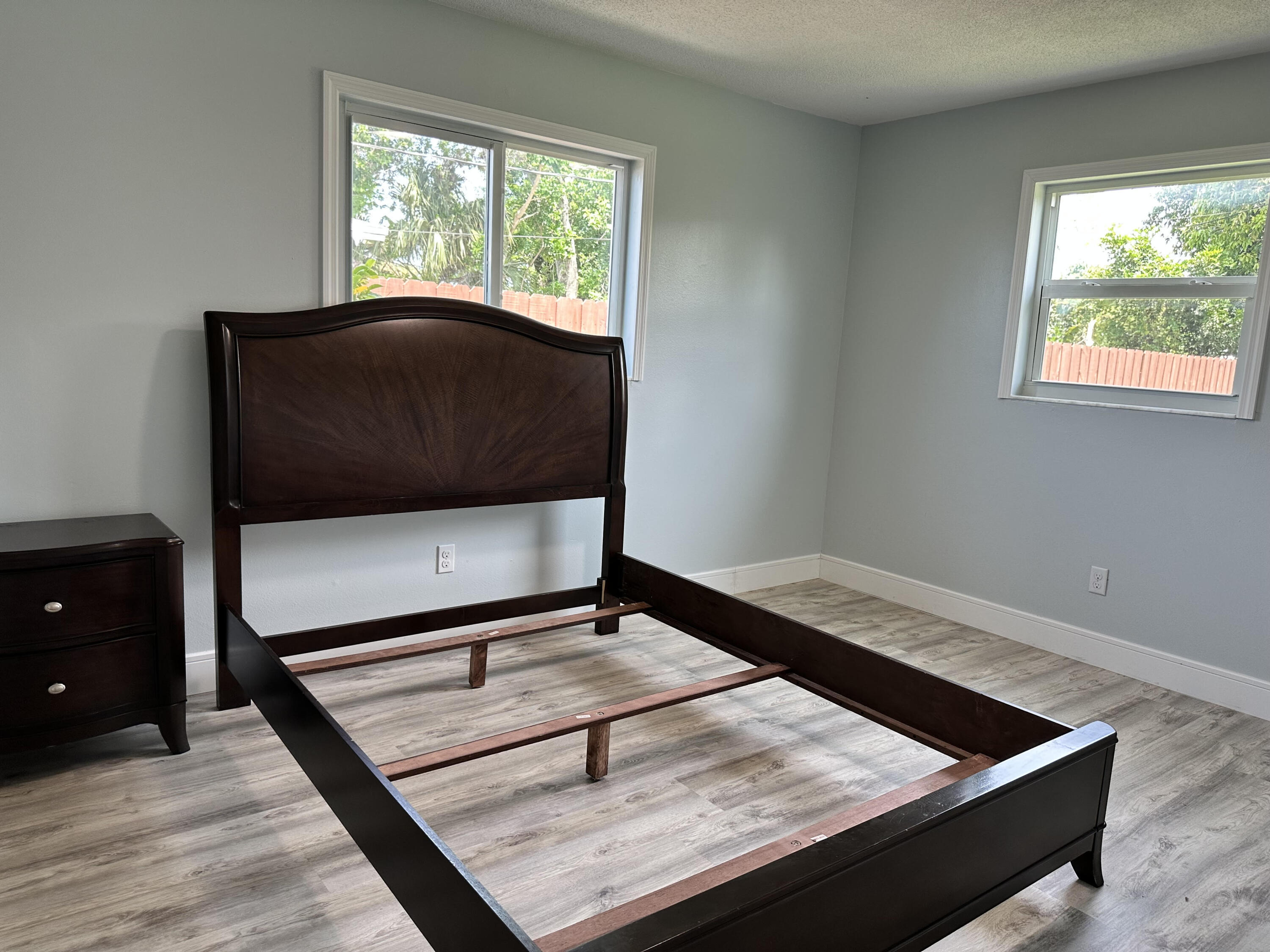 2814 Southeast Indian Street Stuart, FL 34997 - Photo 10 of 23 a living room with a bed furniture and a window