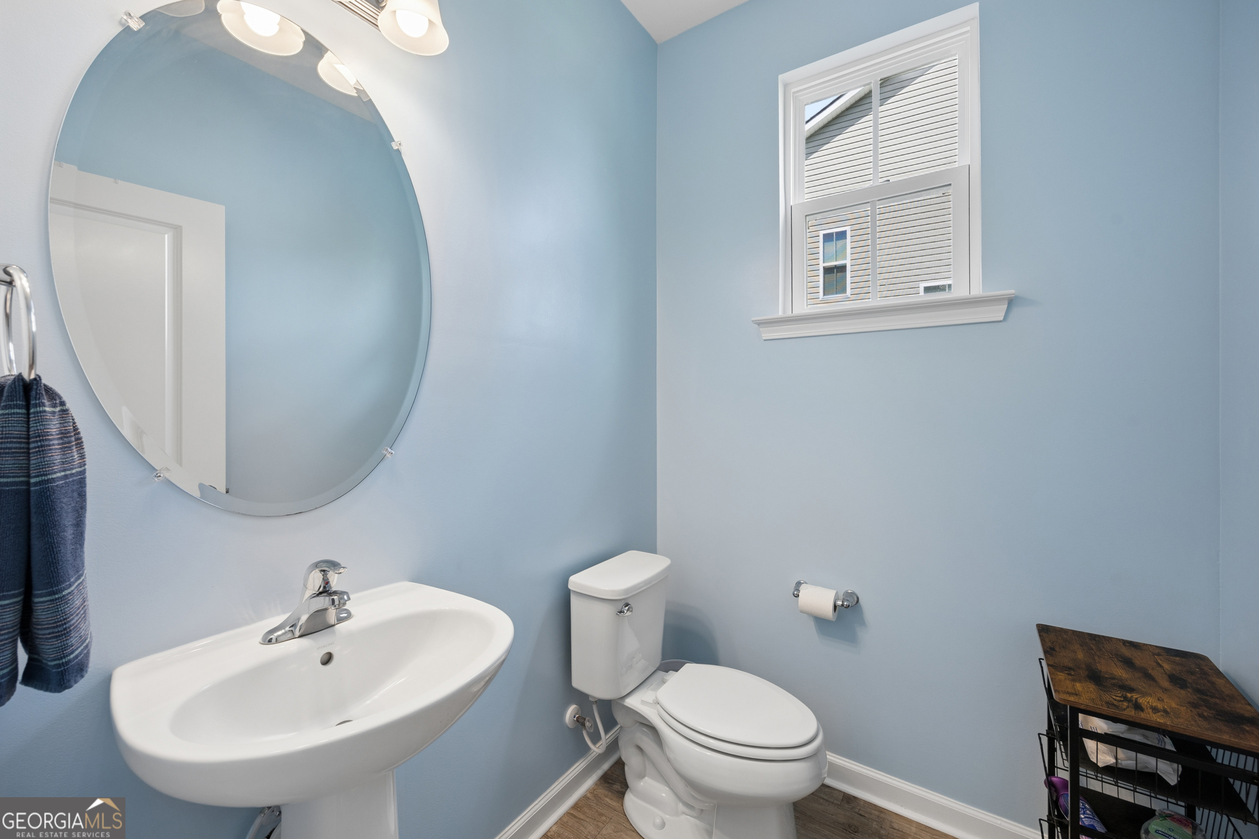 369 Waybridge Way Richmond Hill, GA 31324 - Photo 5 of 40 a bathroom with a sink a mirror and a toilet