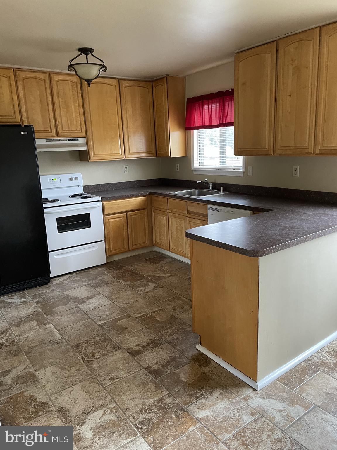 2 White Drive Newark, DE 19702 - Photo 12 of 29 a kitchen with stainless steel appliances granite countertop a stove a sink and a microwave
