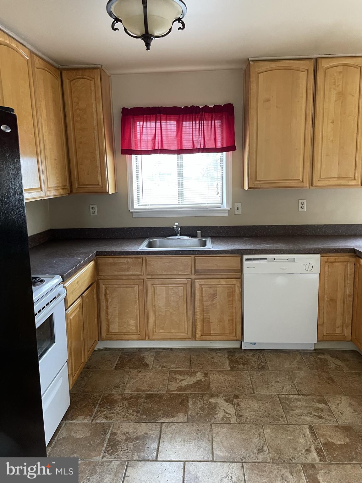 2 White Drive Newark, DE 19702 - Photo 13 of 29 a kitchen with stainless steel appliances granite countertop a stove a sink and a microwave