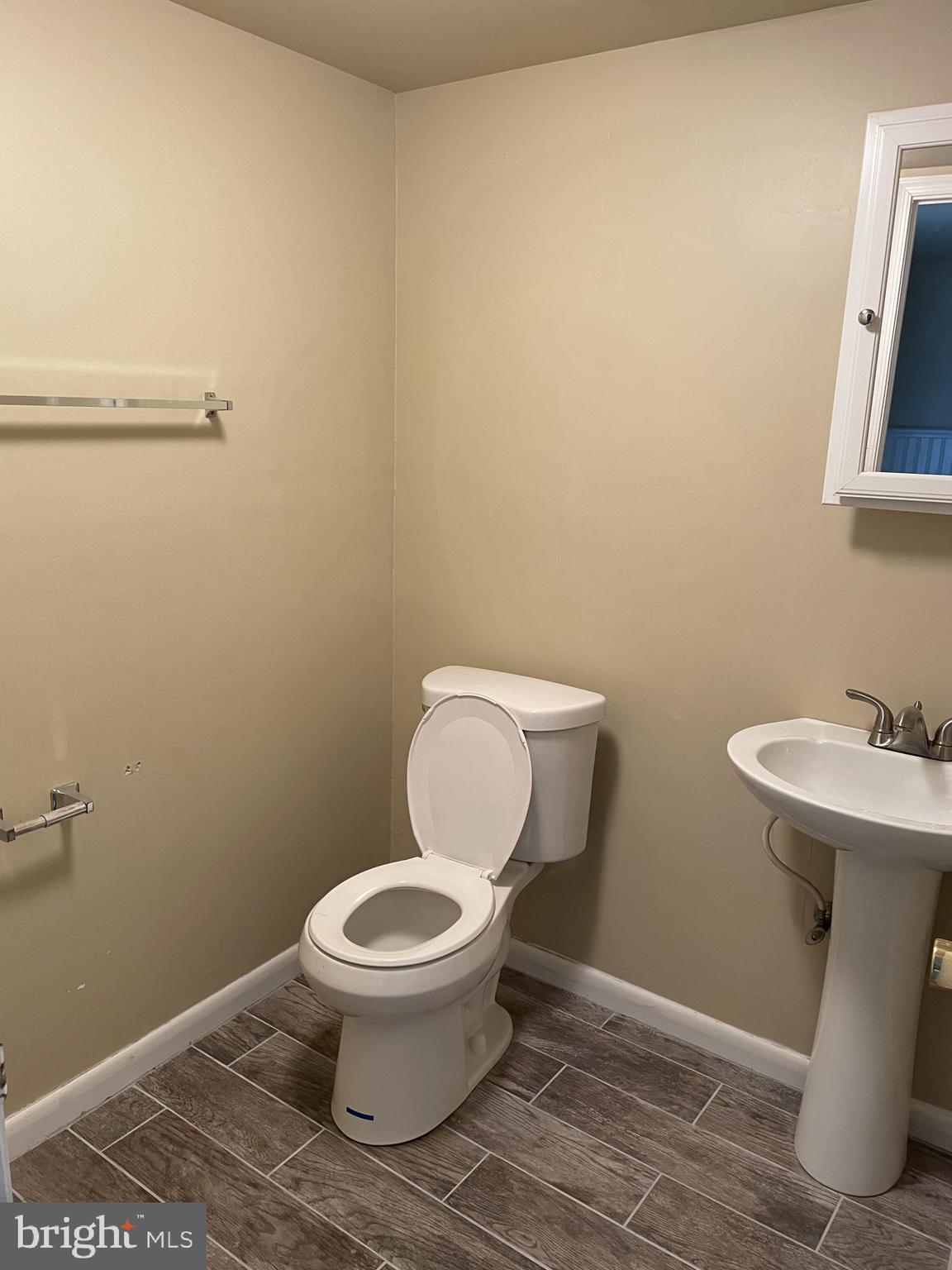 2 White Drive Newark, DE 19702 - Photo 7 of 29 a white toilet sitting next to a bathroom sink