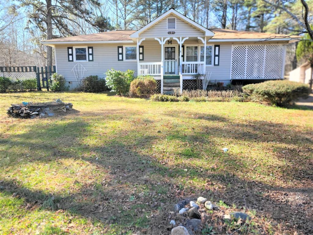 214 Jane Harris Road Dallas, GA 30157 - Photo 1 of 1 a front view of a house with a yard